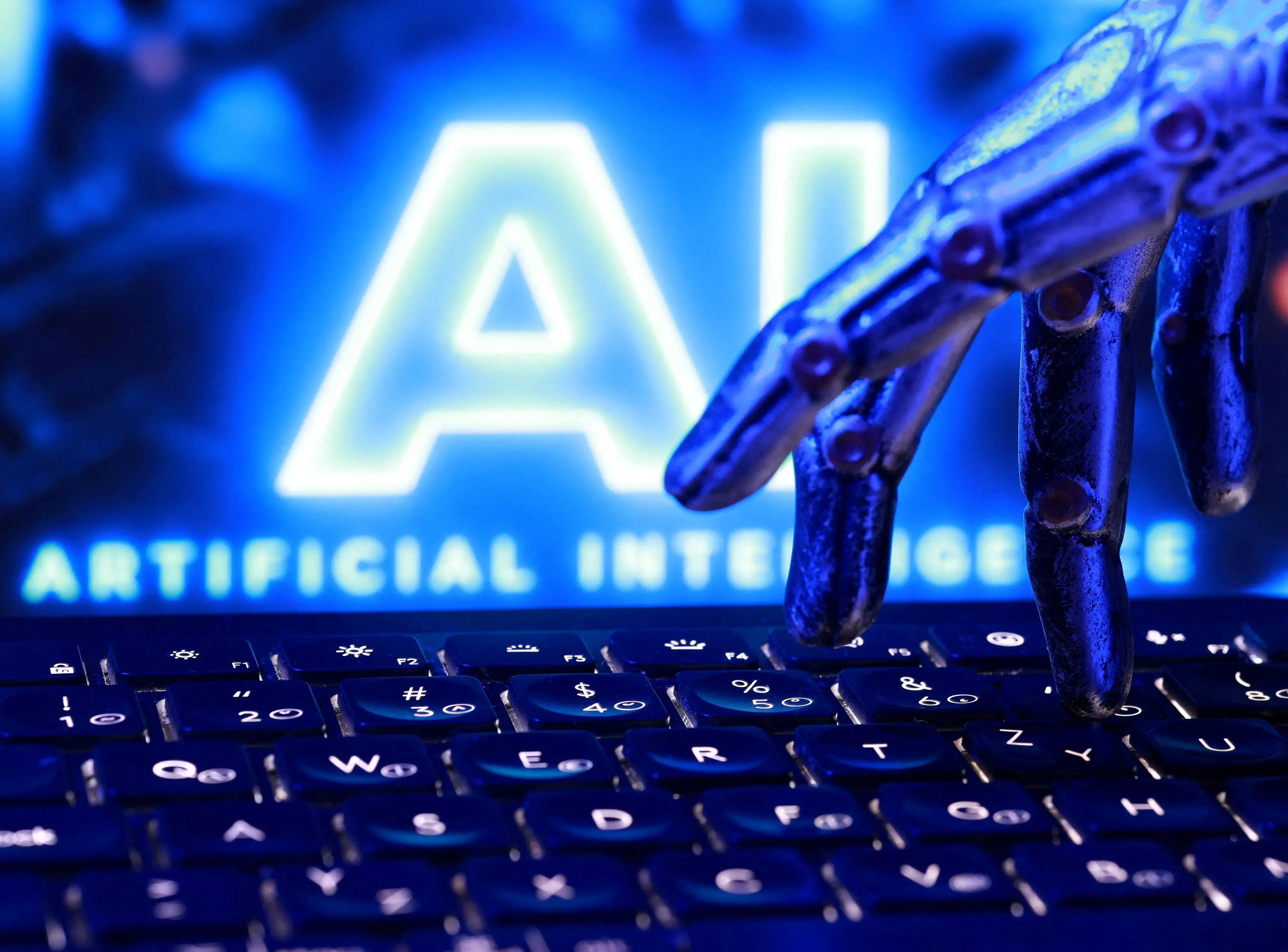 "AI Artificial Intelligence" words, a keyboard and a robotics hand in this illustration taken, September 23, 2026.